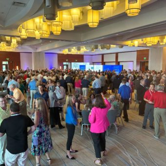 Attendees at the BCI Convention mingling and networking.